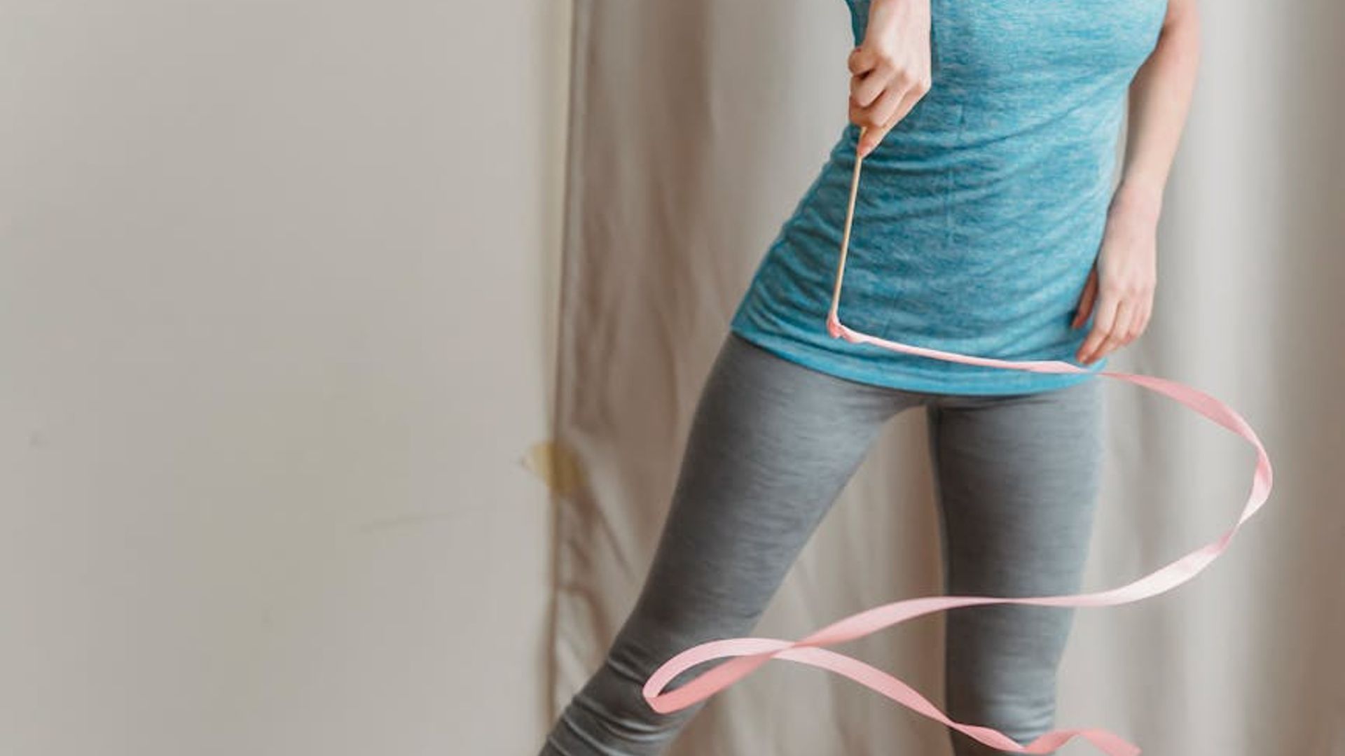 Active person moving rhythmically in a bright studio space.